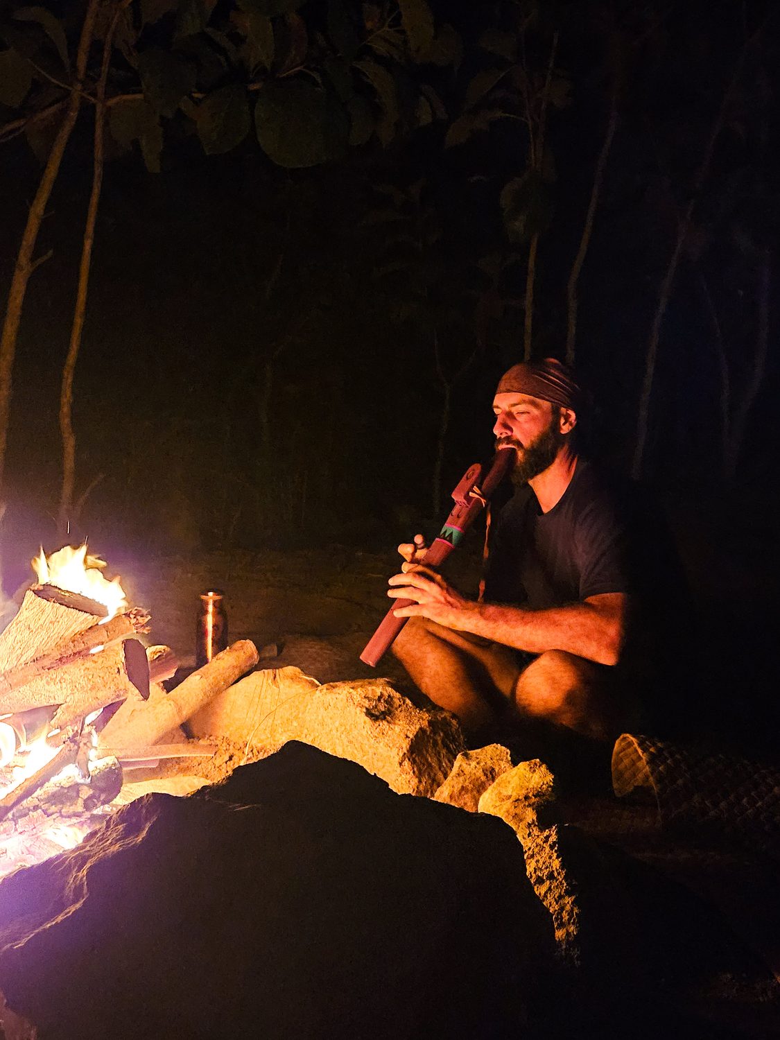 Flute by fire at the wild lands camp