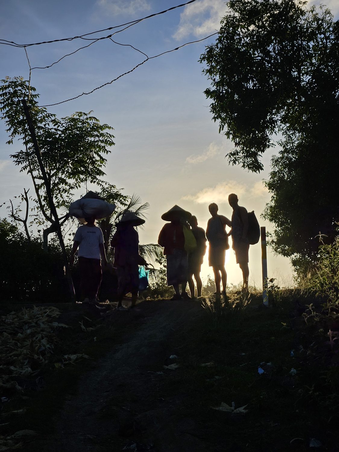 Sasak walkers at sunrise on Tampah